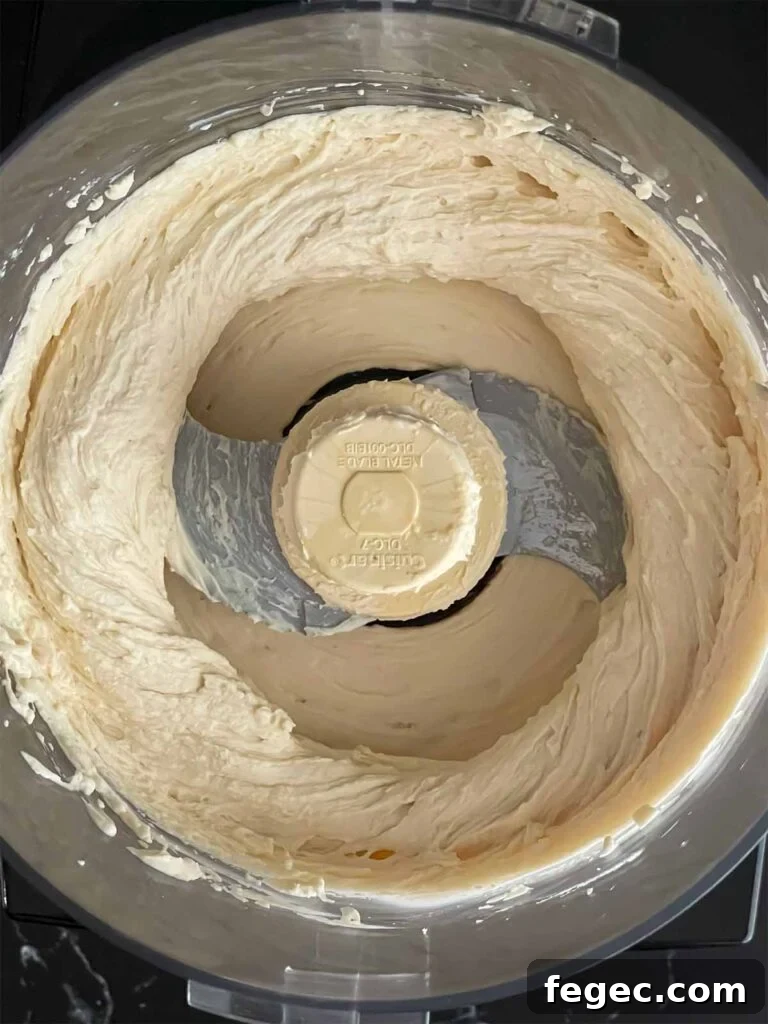 Ricotta mousse whipped in the bowl of a food processor.