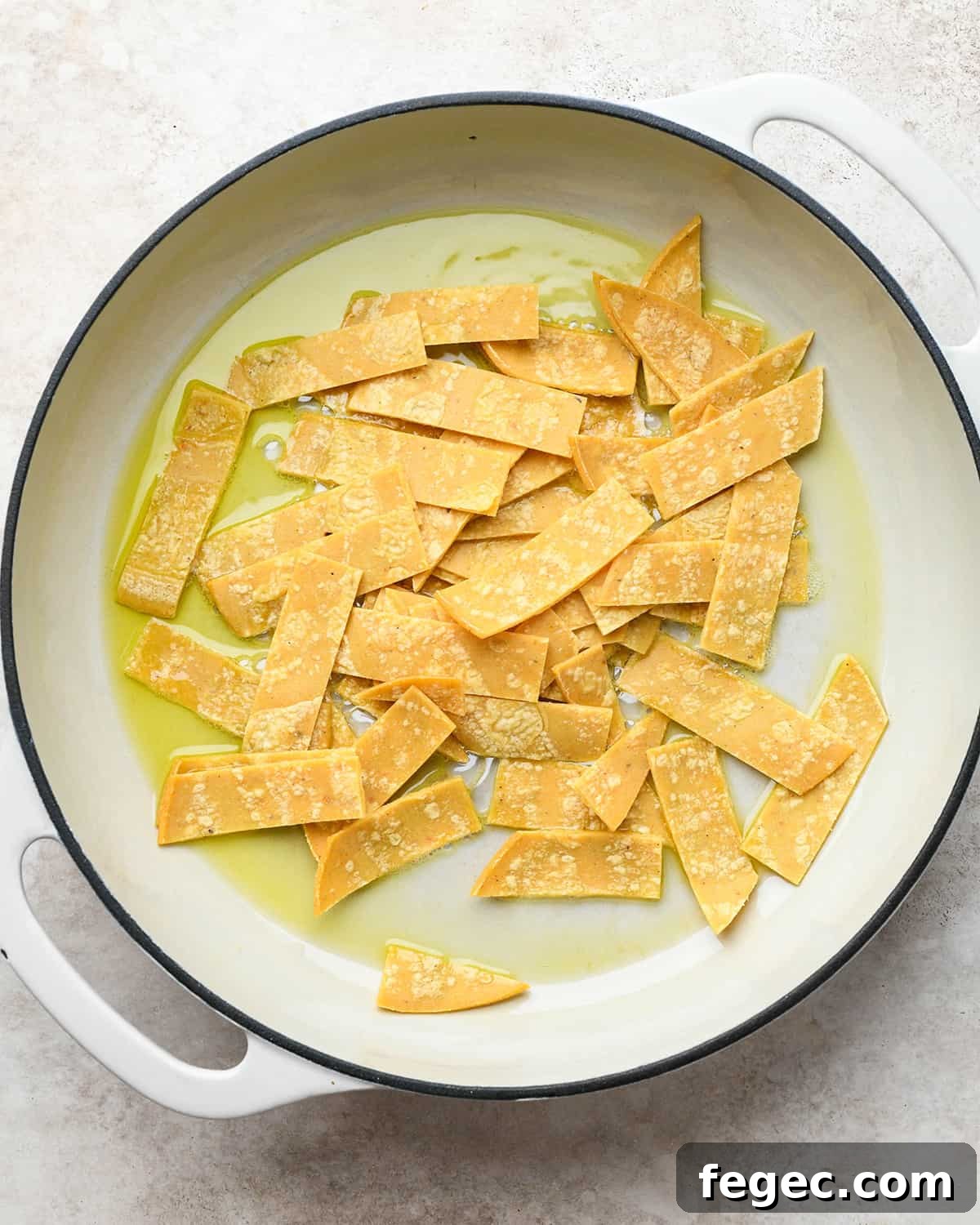 tortilla strips in a frying pan