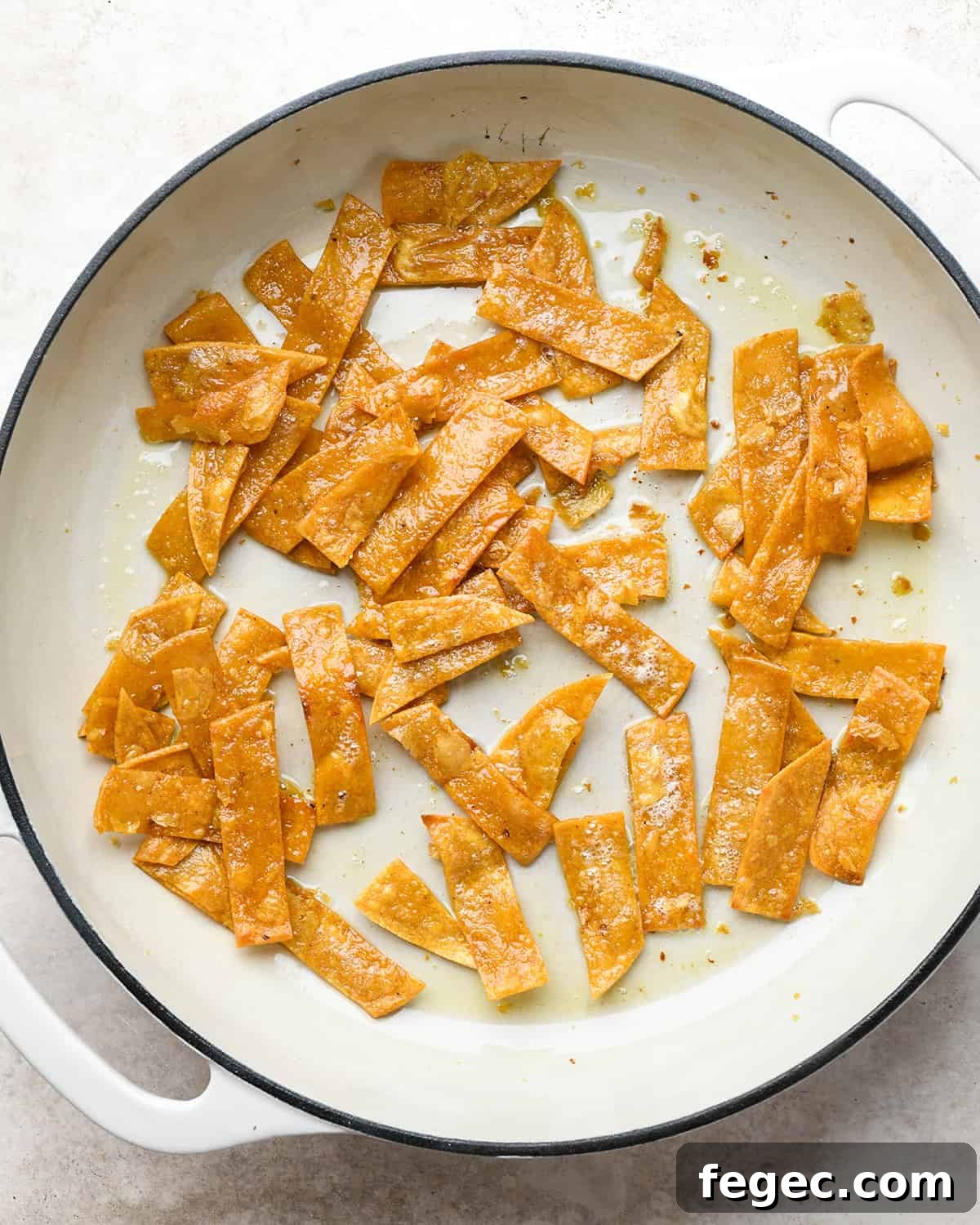 Homemade Tortilla Strips in a frying pan