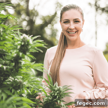 A picture of Emily Kyle with a cannabis plant.