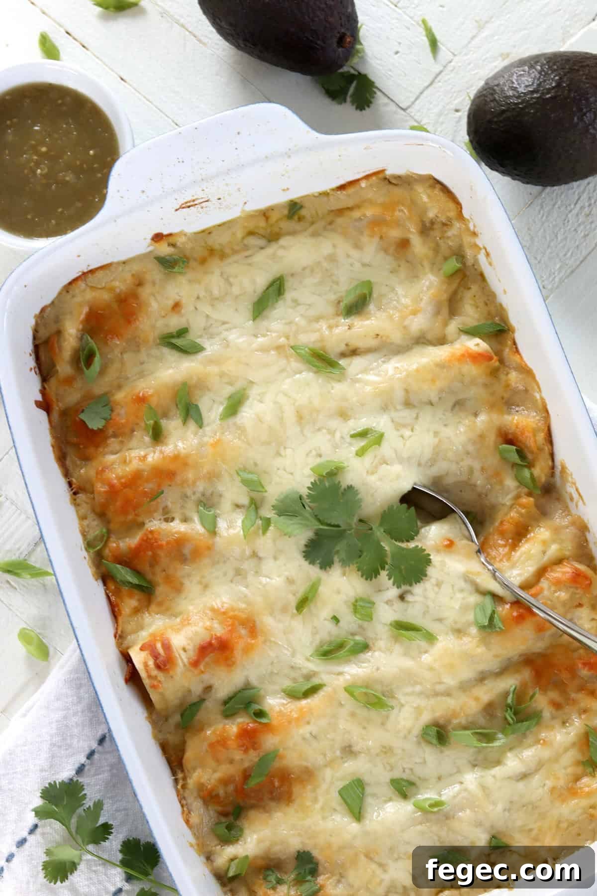 Vegan green enchiladas in a 13 inch by 9 inch baking dish.