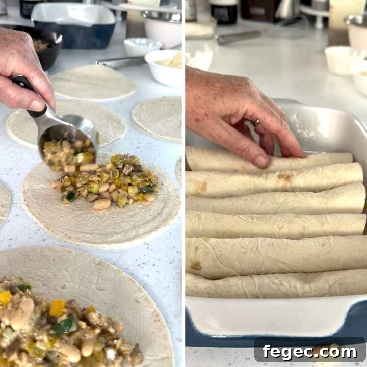 Filling the vegan enchiladas with filling then rolling and placing in a baking dish.