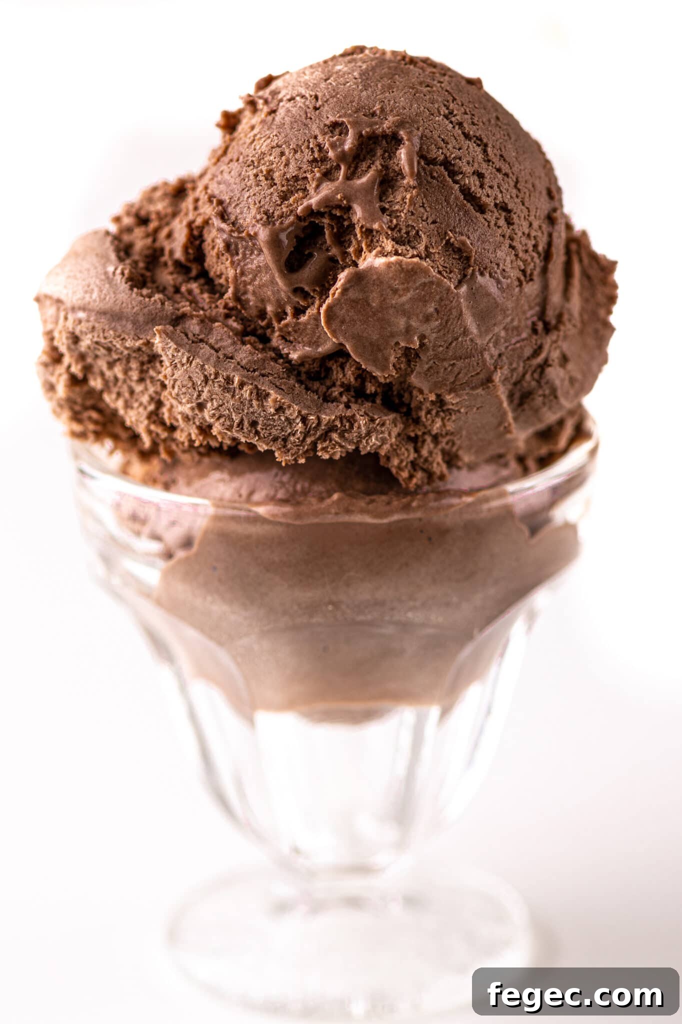 A sundae bowl with a large scoop of keto chocolate ice cream.
