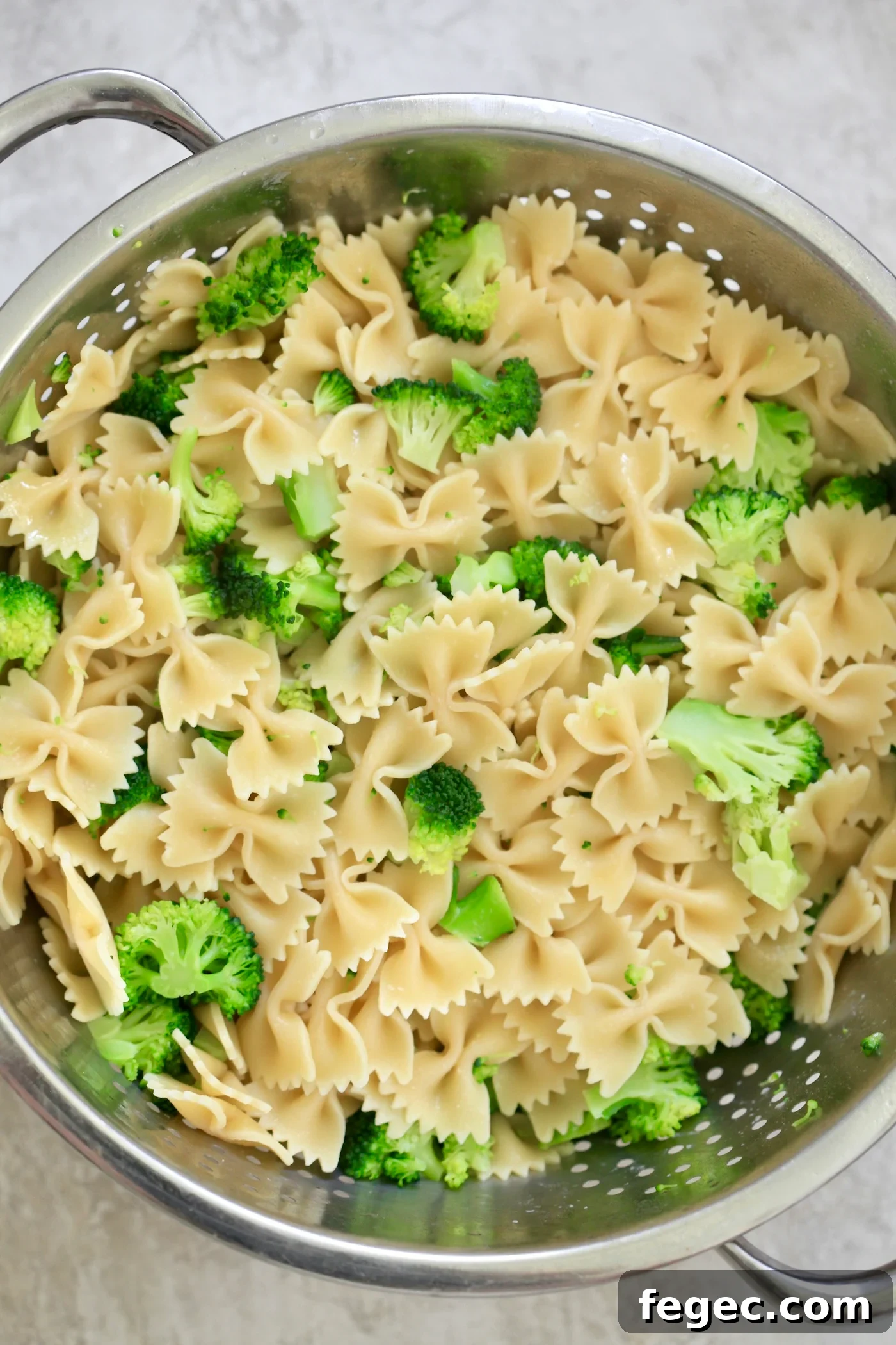 pasta and broccoli in strainer