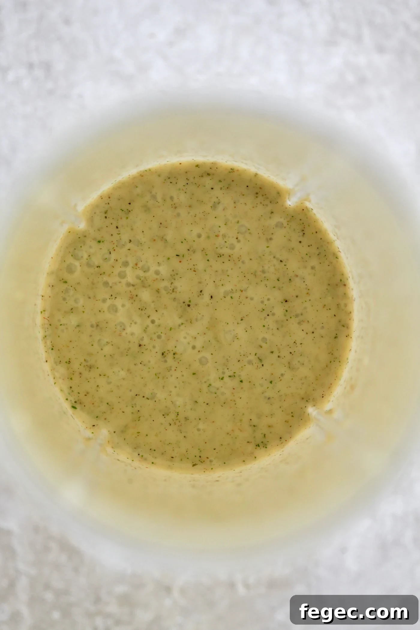 blended yellow dressing in jar.