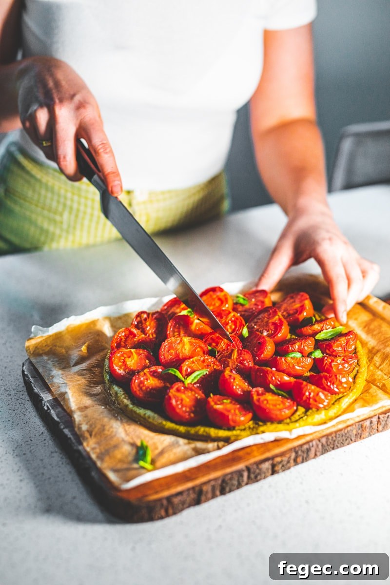 Pesto and Tomato Tart Recipe: Flaky Tart with Fresh Basil 4 Cutting the Pesto & Tomato Tart - Georgie Eats