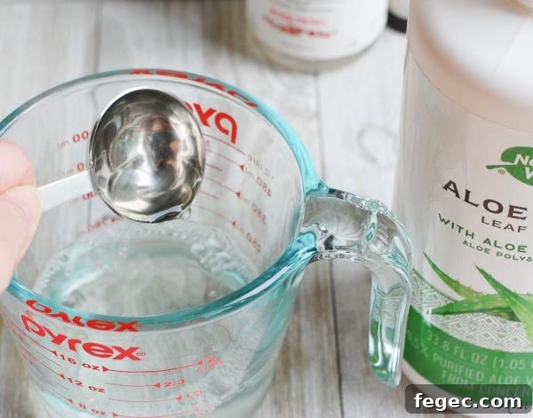 mixing aloe vera into homemade face toner
