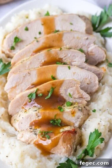 Sliced turkey breast with gravy.