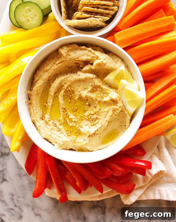 My Go To Hummus - This simple hummus recipe is perfect for dipping with veggies or crackers for a healthy appetizer, side, or snack. It only takes 10 minutes to make and uses simple pantry ingredients. It's rich, creamy, and super healthy. #hummus #glutenfree #vegan #easyrecipe | robustrecipes.com