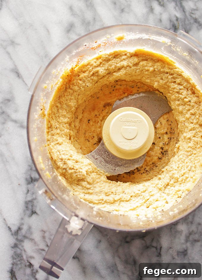 My Go To Hummus - This simple hummus recipe is perfect for dipping with veggies or crackers for a healthy appetizer, side, or snack. It only takes 10 minutes to make and uses simple pantry ingredients. It's rich, creamy, and super healthy. #hummus #glutenfree #vegan #easyrecipe | robustrecipes.com