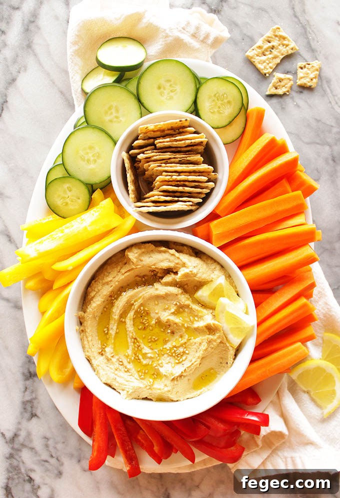 My Go To Hummus - This simple hummus recipe is perfect for dipping with veggies or crackers for a healthy appetizer, side, or snack. It only takes 10 minutes to make and uses simple pantry ingredients. It's rich, creamy, and super healthy. #hummus #glutenfree #vegan #easyrecipe | robustrecipes.com