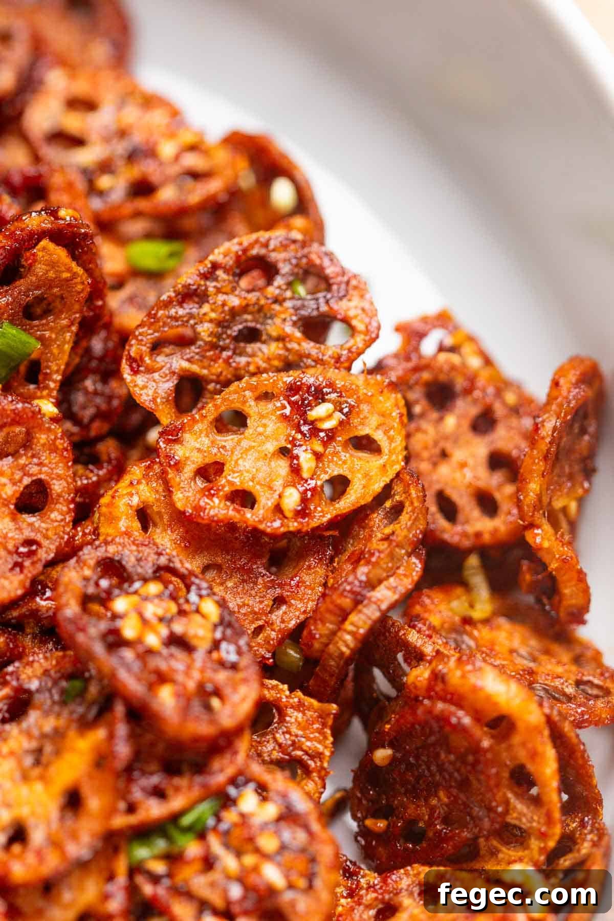 close up image of Korean crispy lotus stem to show it's thin and crispy texture