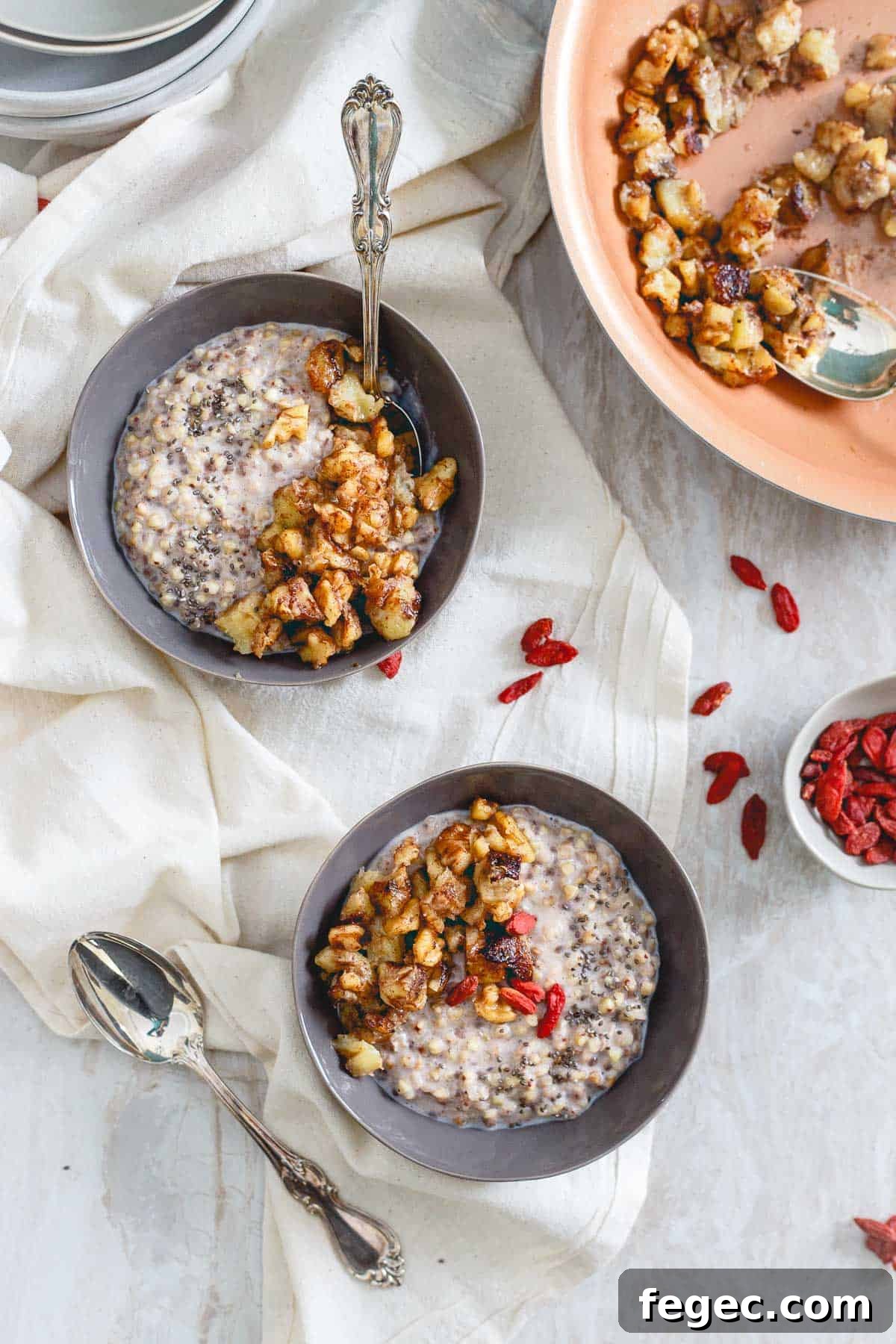 This warm breakfast cereal made with quinoa or buckwheat groats is topped with a sweet caramelized banana walnut topping.
