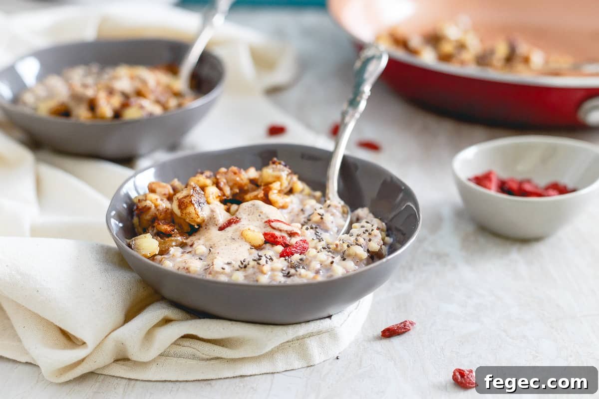 Warm quinoa cereal is topped with almond butter, caramelized banana walnut compote and some goji berries for a healthy and satisfying breakfast.