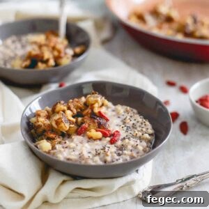 This warm quinoa cereal is topped with a caramelized banana and walnut compote, drizzled in almond butter and garnished with superfoods like goji berries and chia seeds.