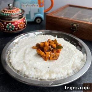 Traditional Kerala style mango pickle served with rice and yogurt.