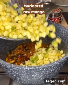Marinated raw mango for Kerala style mango pickle.
