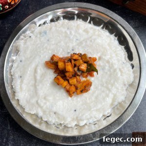 Traditional Kerala style mango pickle served with rice and curry.