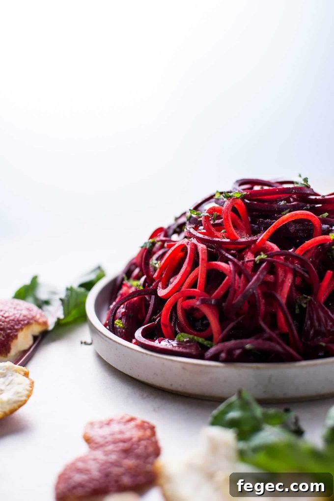spiralized raw beet salad with blood oranges in a bowl