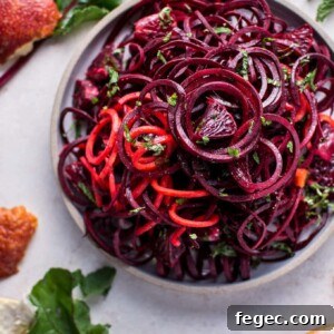 bowl of spiralized raw beet salad with blood oranges