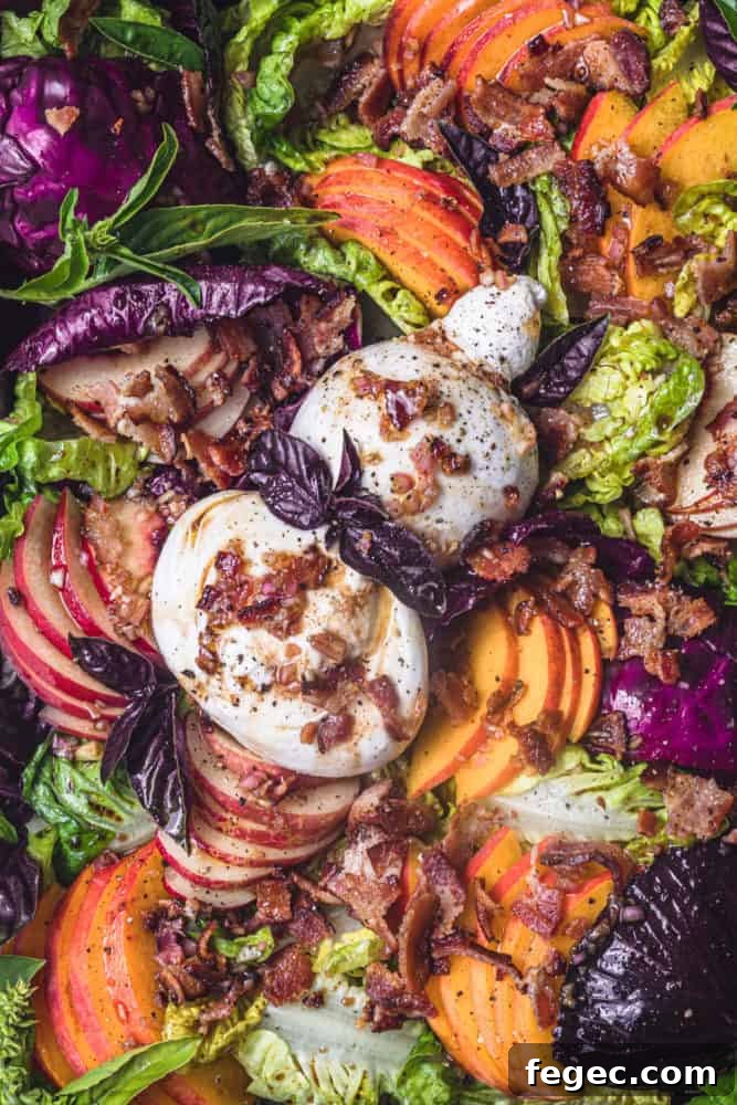 Close up shot: Peach Salad with Burrata & Crispy Bacon, all assembled, overhead shot.