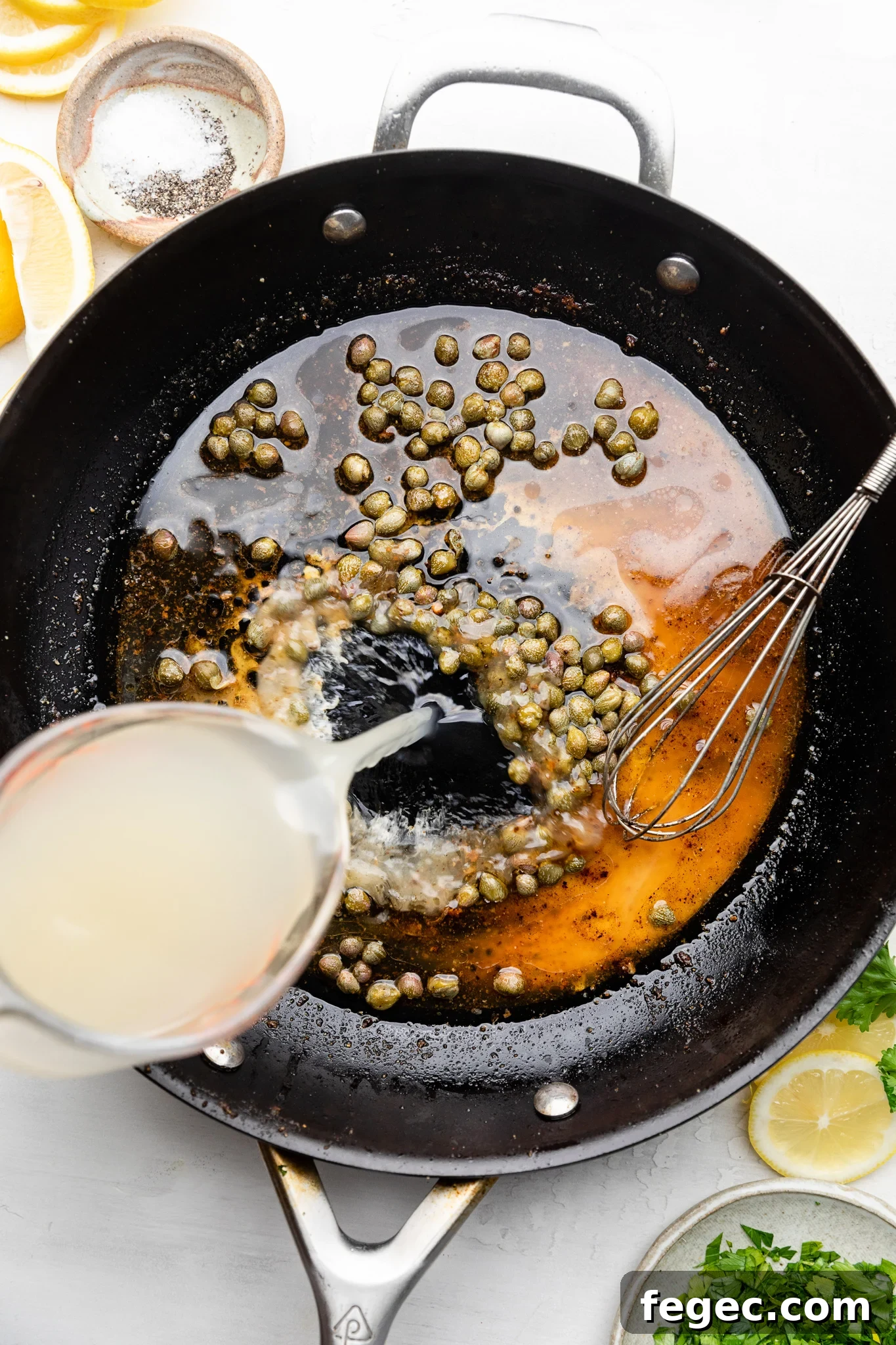 Gluten-Free Chicken Piccata with Lemon Caper Sauce 5 pouring broth into a skillet with lemon juice and capers