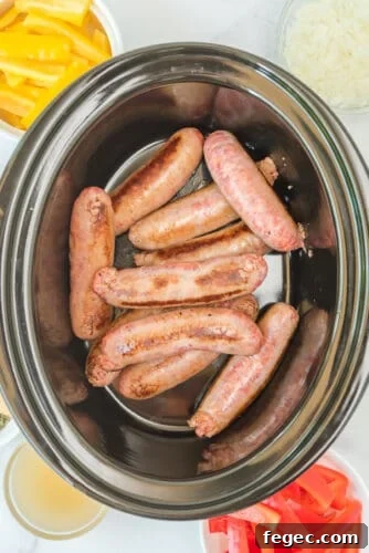 Place sausages in slow cooker.