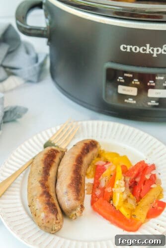 Sausage and peppers on plate.