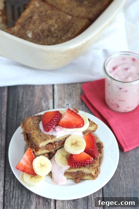 Stuffed French Toast Breakfast Casserole with Strawberries and Cream Topping