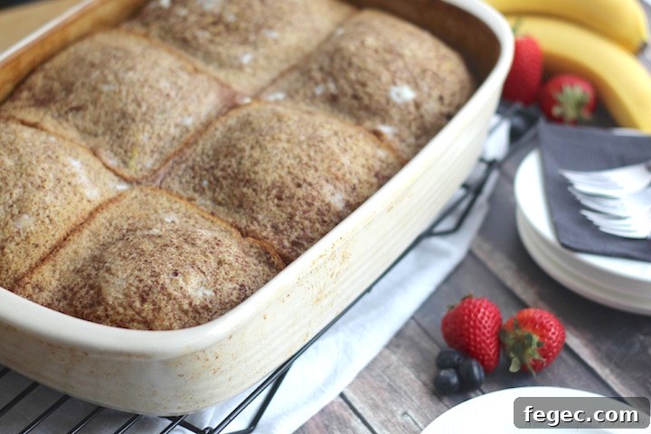 Slices of stuffed French toast on a plate with fruit
