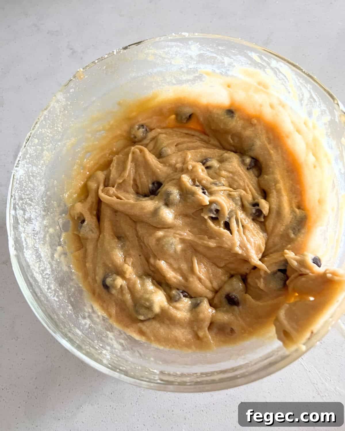 Cookie dough batter mixed together in a bowl. 