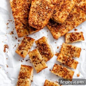 Crispy Vegan Garlic Bread Recipe You’ll Love 12 several Easy Vegan Garlic Bread pieces on white surface