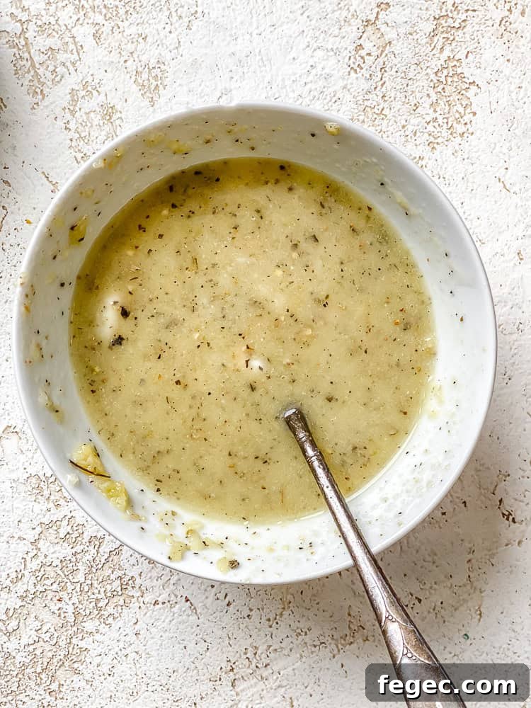 Crispy Vegan Garlic Bread Recipe You’ll Love 6 process shot showing vegan butter mixture in bowl