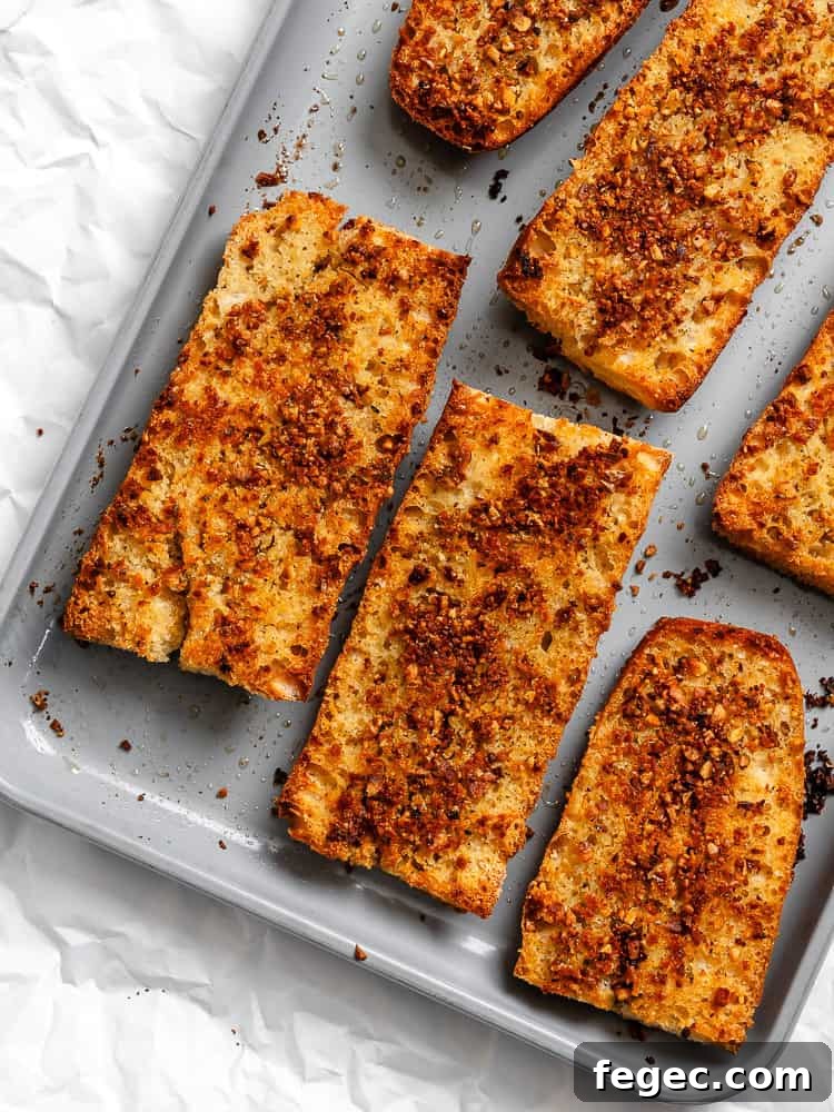 Crispy Vegan Garlic Bread Recipe You’ll Love 9 completed Easy Vegan Garlic Bread on baking sheet