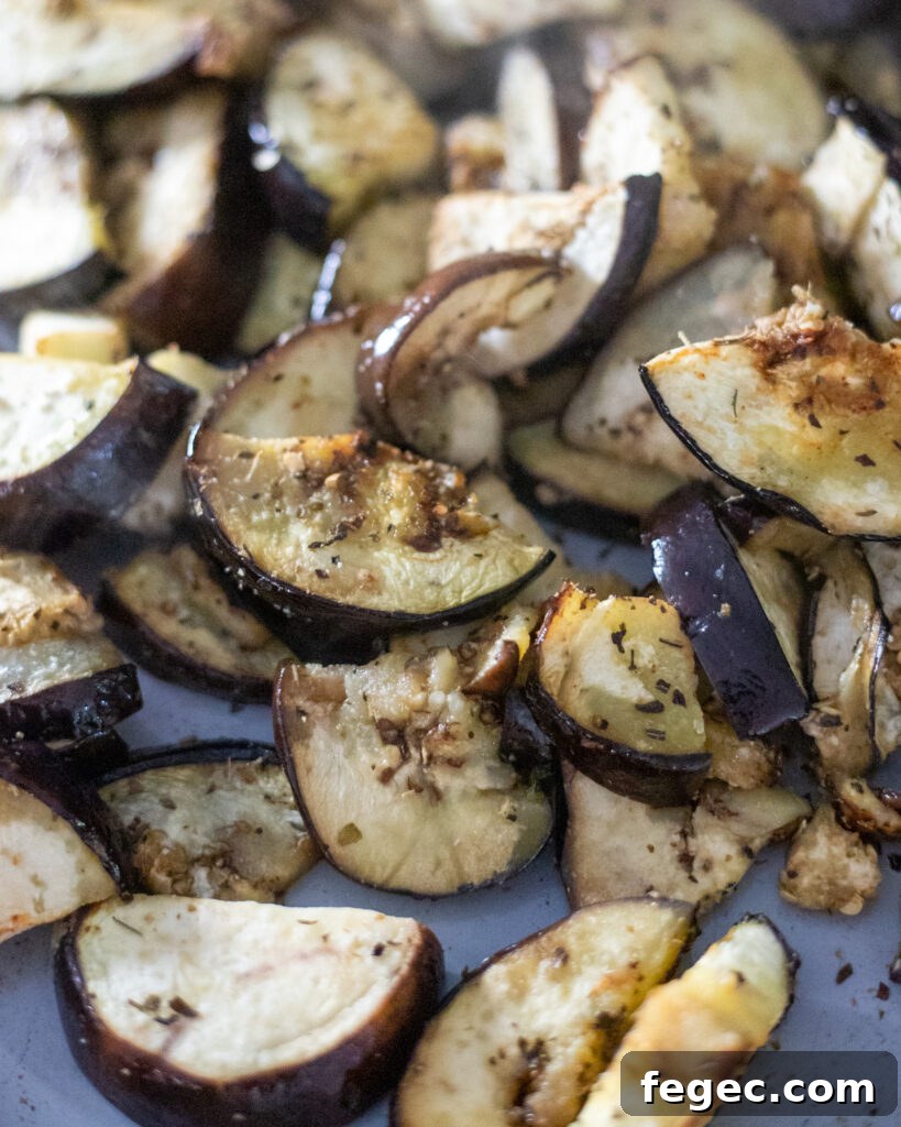 close up view of roasted eggplant on a sheet pan.
