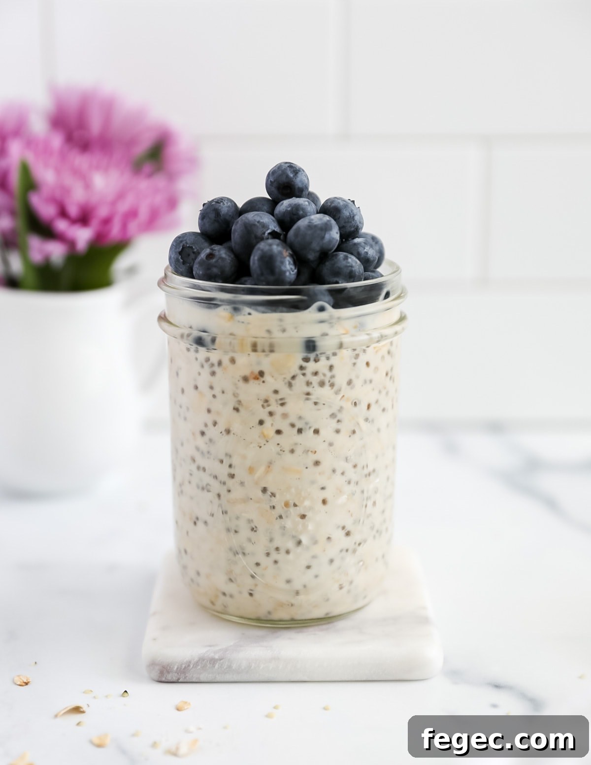 Creamy Chia Seed Overnight Oats Recipe for Busy Mornings 6 A side shot of oats in a jar with blueberries on top