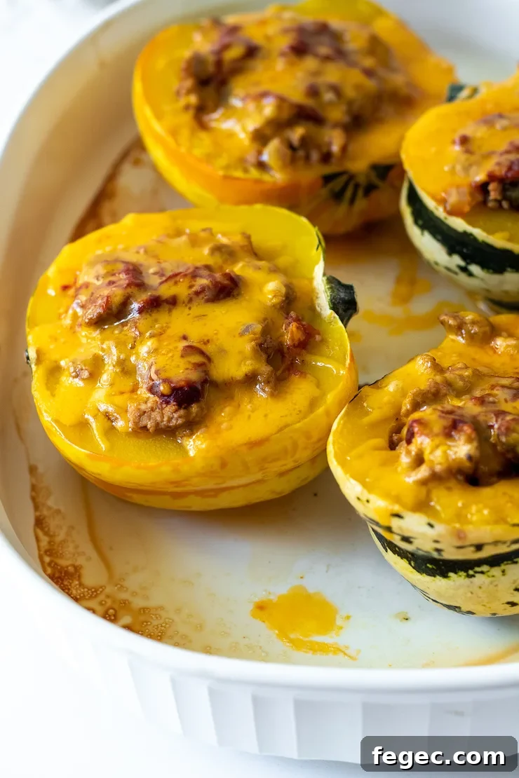 Herbed Turkey Stuffed Acorn Squash Recipe for Fall Dinner 9 Squash in baking dish.