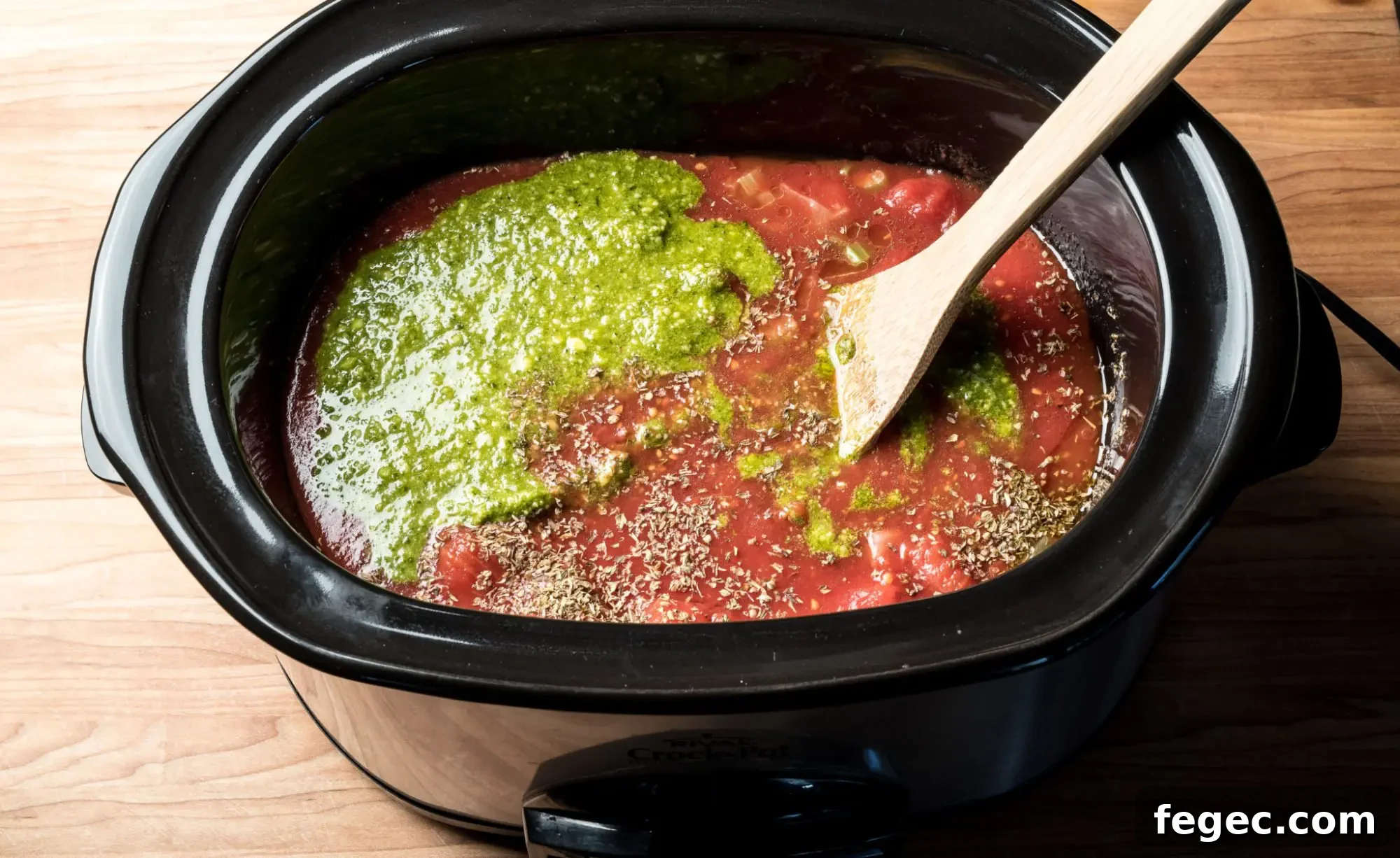Stock pot of Creamy tomato basil soup with parmesan