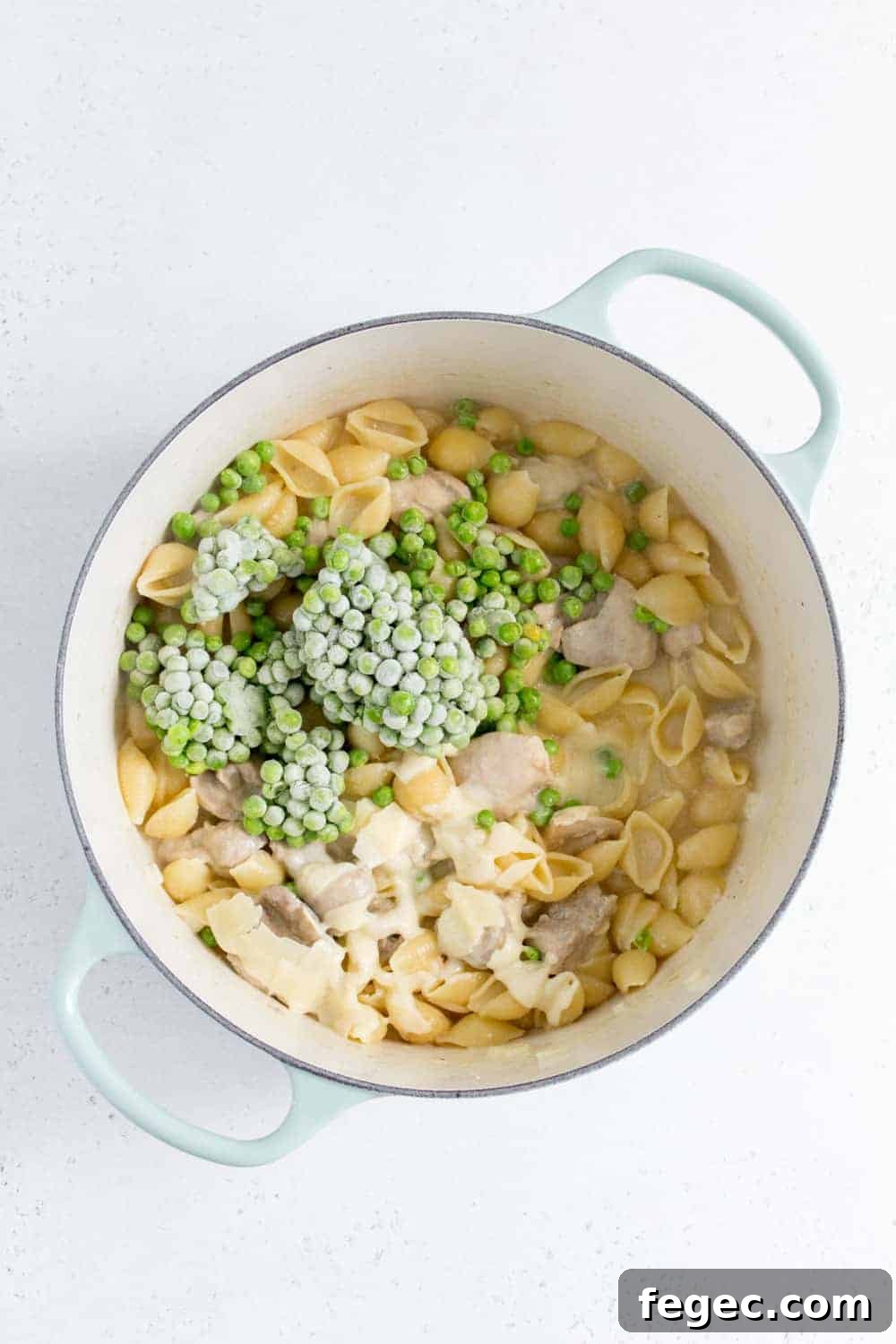 dutch oven with frozen peas and parmesan added inside