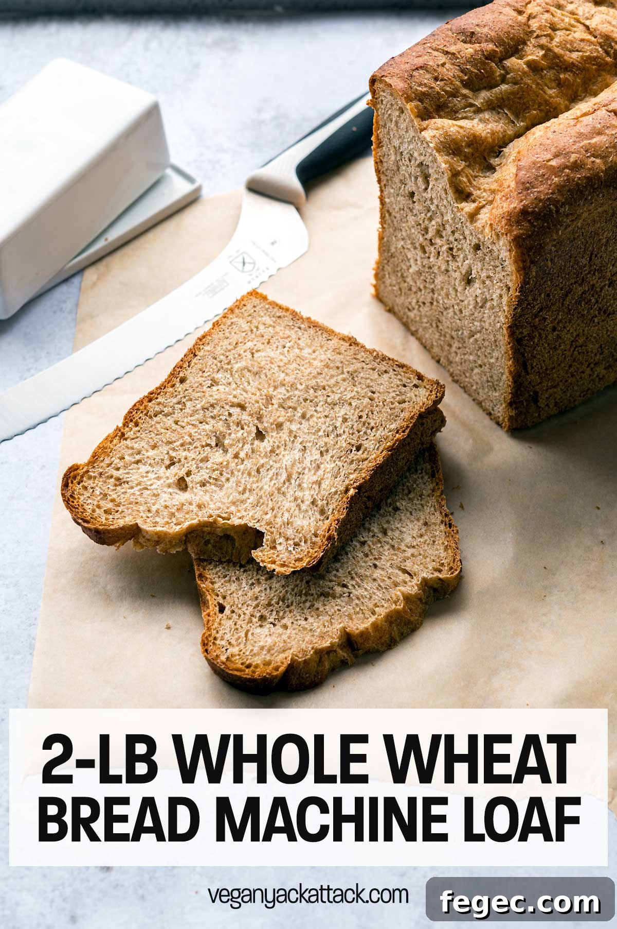 two slices of wheat bread next to the loaf and bread knife with text overlay "2-lb whole wheat bread machine loaf"