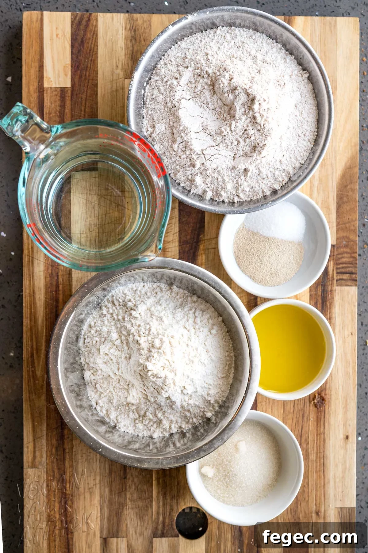 ingredients in ramekins on a wood cutting board