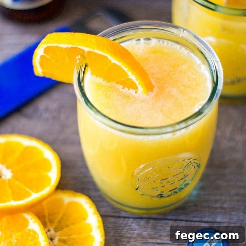 overhead picture of cocktail with orange wedge