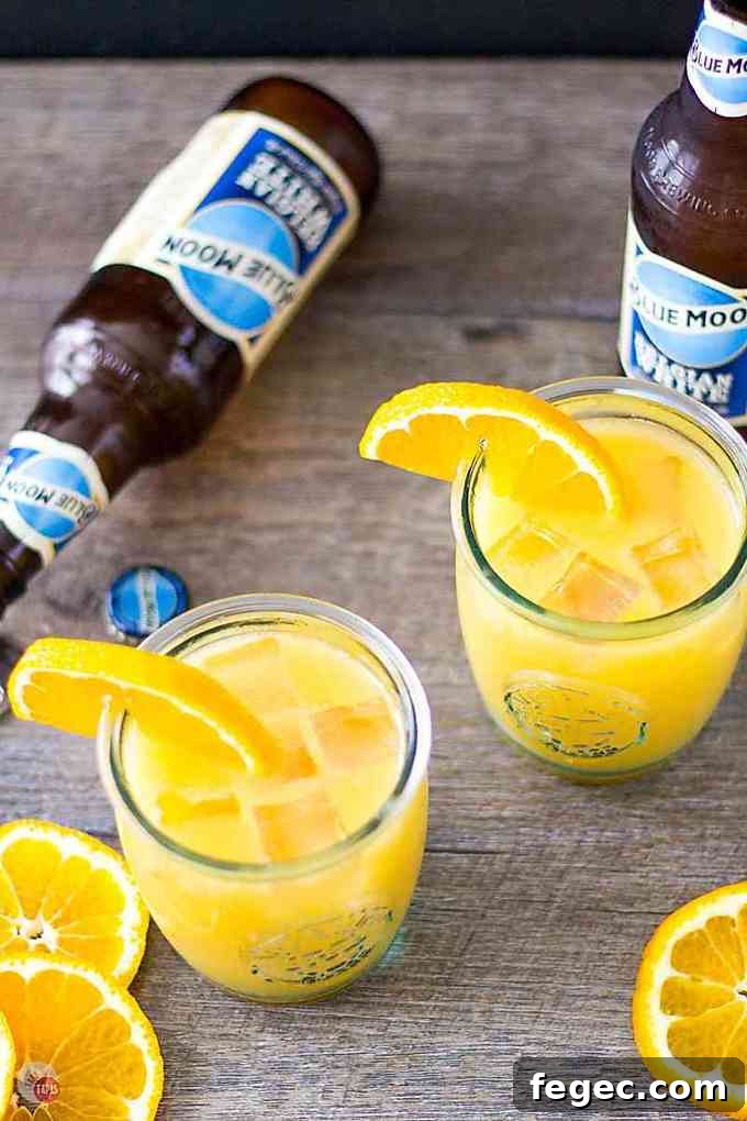 orange shandy cocktails with ice and beer bottles