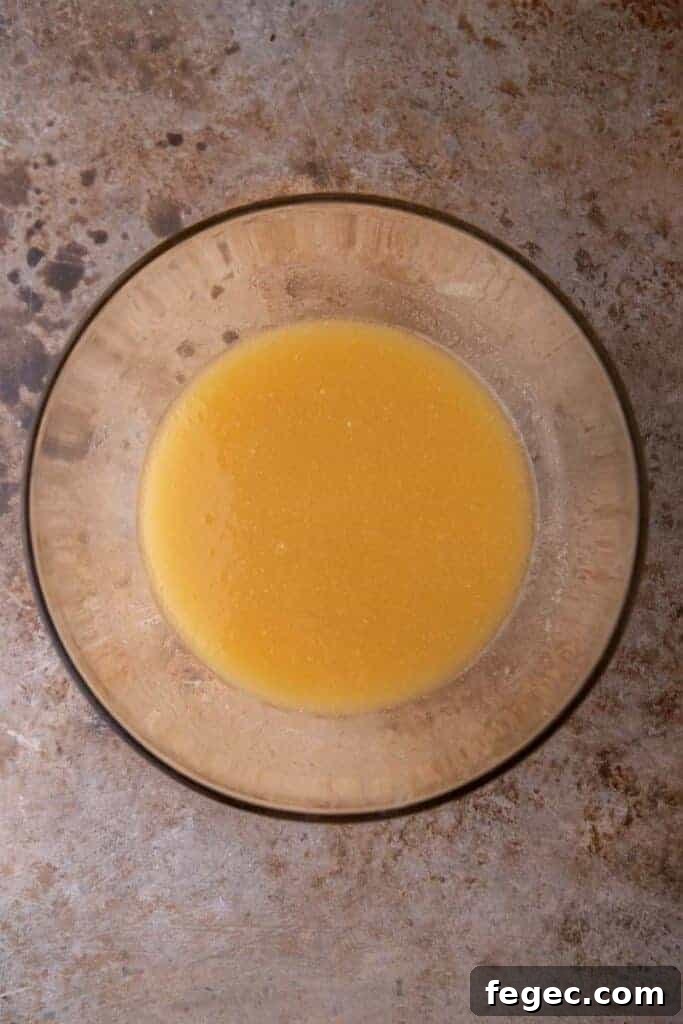 Soft Honey Cookies Recipe for Chewy, Melt-in-Your-Mouth Cookies 6 Wet ingredients in a bowl