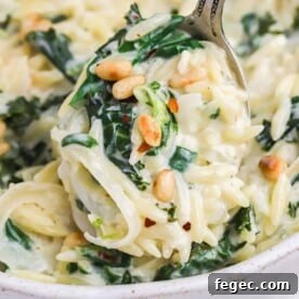 Creamy lemon orzo with greens, topped with pine nuts.