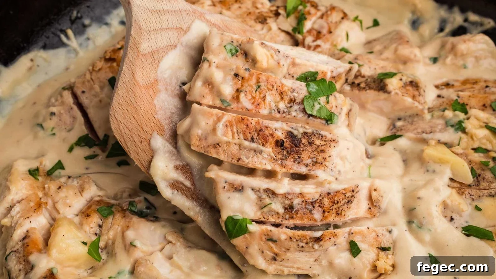 15 Flavor-Packed Skillet Recipes for Quick Cleanup 5 Creamy garlic chicken with golden seared pieces coated in thick sauce in a skillet.