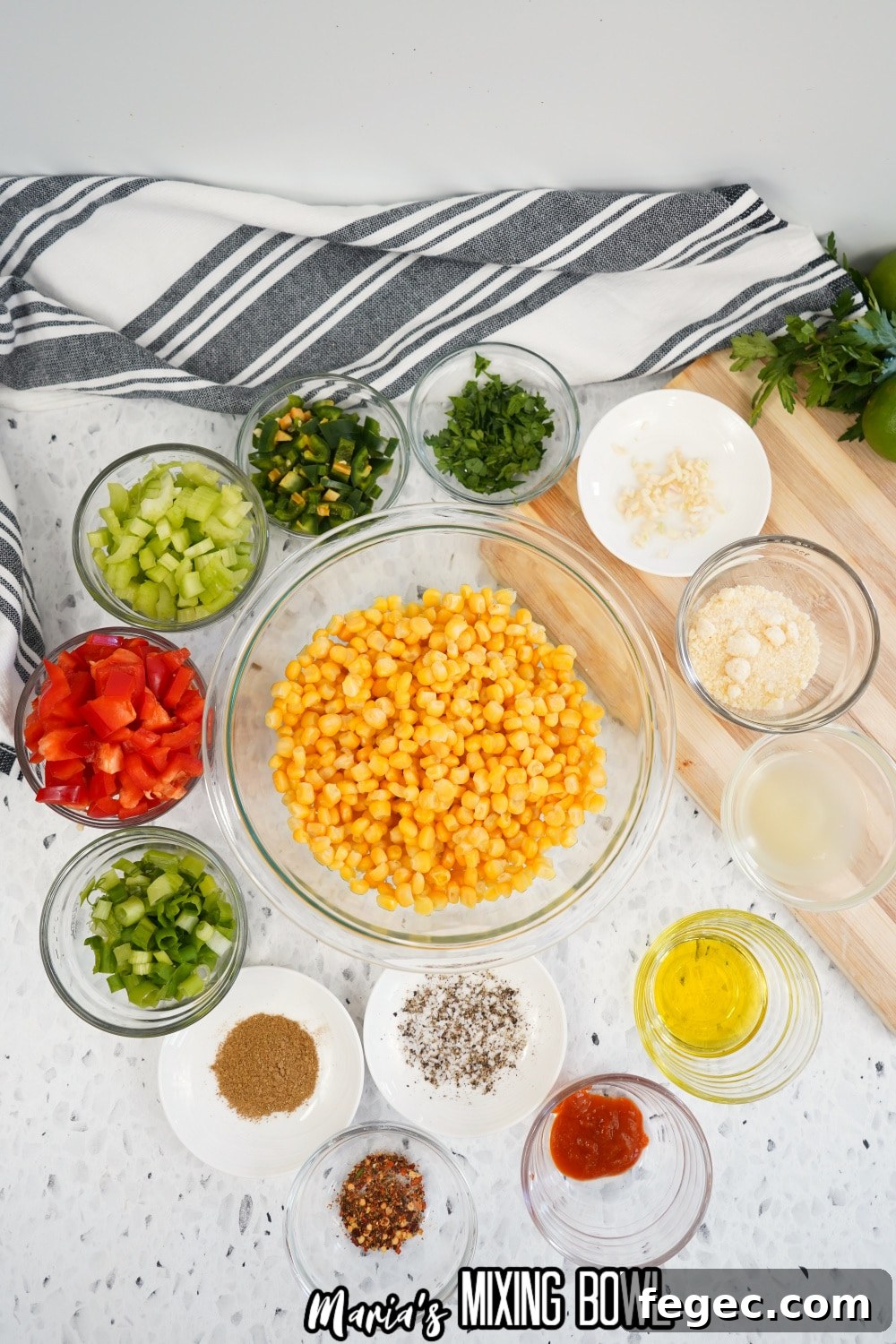 corn, green onions, tomatoes, celery, jalapeno, oil, garlic, and seasonings in a small bowl