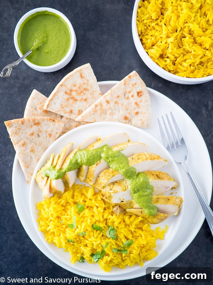 Juicy Yogurt-Marinated Chicken Breasts for Tender Grilling 3 Yogurt marinated chicken breasts served with turmeric rice.