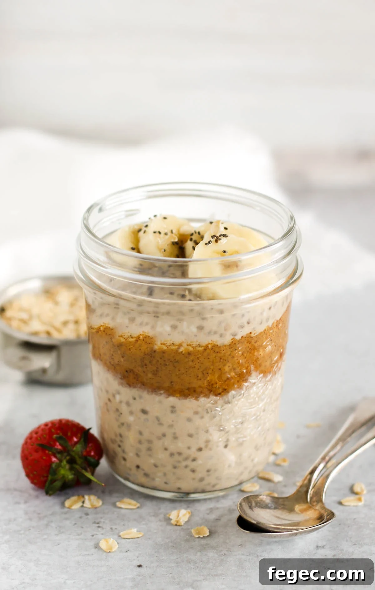 High-Protein Overnight Oats — 5-Ingredient Recipe 5 Overnight oats topped with sliced banana and chia seeds in a mason jar.