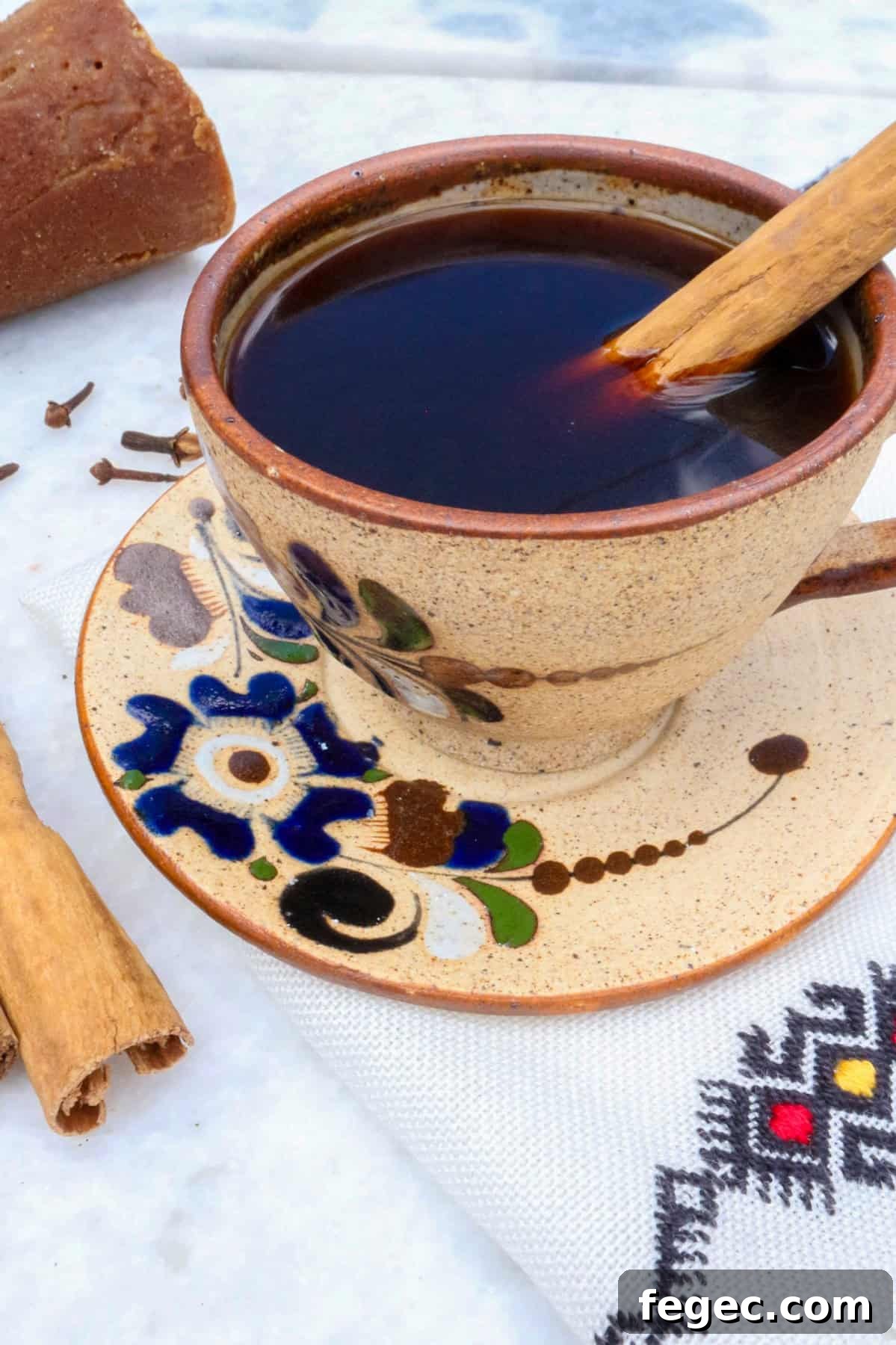 Authentic Mexican Café de Olla Recipe for Traditional Flavor 2 Authentic Cafe de Olla Recipe, coffee in a mug with a cinnamon stick